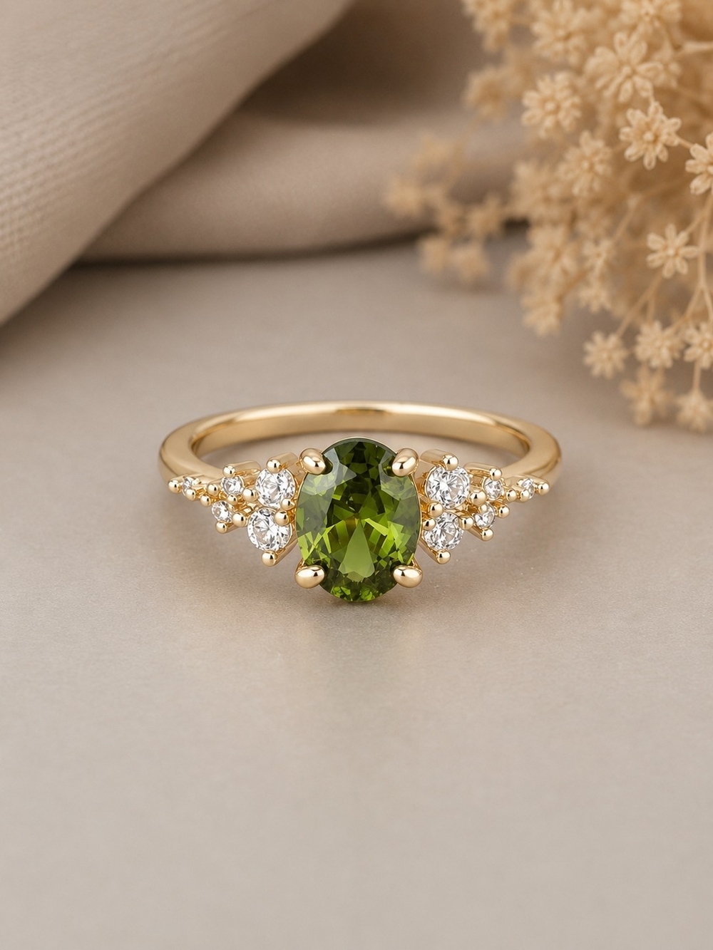 Gold Ring with Green Oval Gem and Side Stone Accents